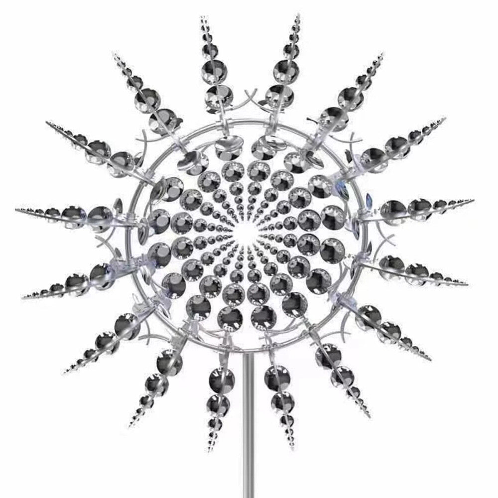 Metal kinetic wind spinner with silver reflective blades on a garden stake