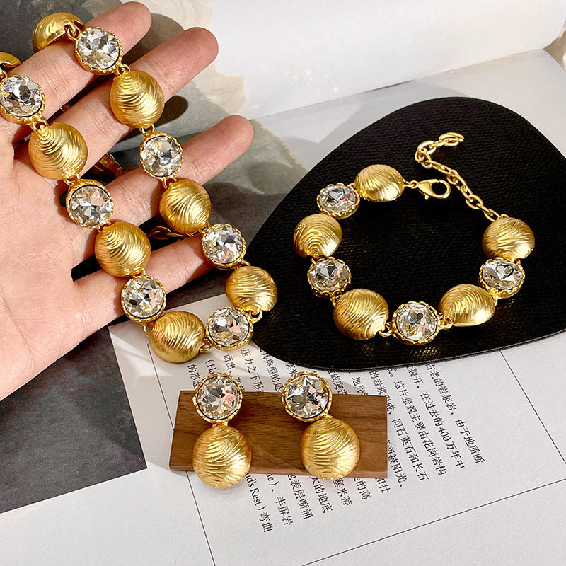 Gold-Tone Cuban Chain Necklace with Crystal Pendant