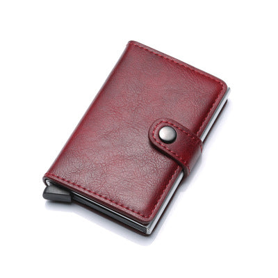 Red leather wallet with metal clip on a white background