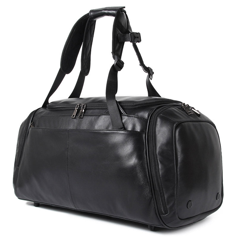 Black leather duffel bag with shoulder straps on a white background