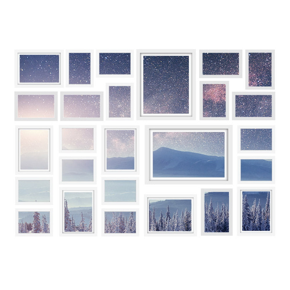 26 white photo frames arranged as a gallery wall